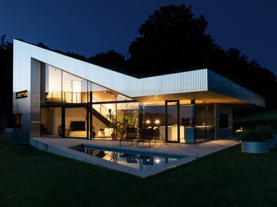 Caramel Architekten Folds a Green Roof Down to Earth in an Austrian Hilltop House