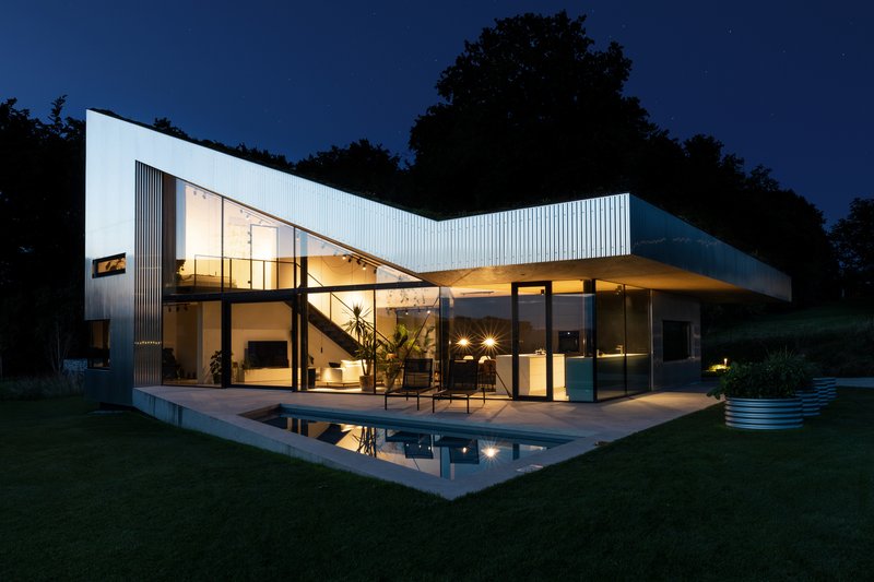Caramel Architekten Folds a Green Roof Down to Earth in an Austrian Hilltop House