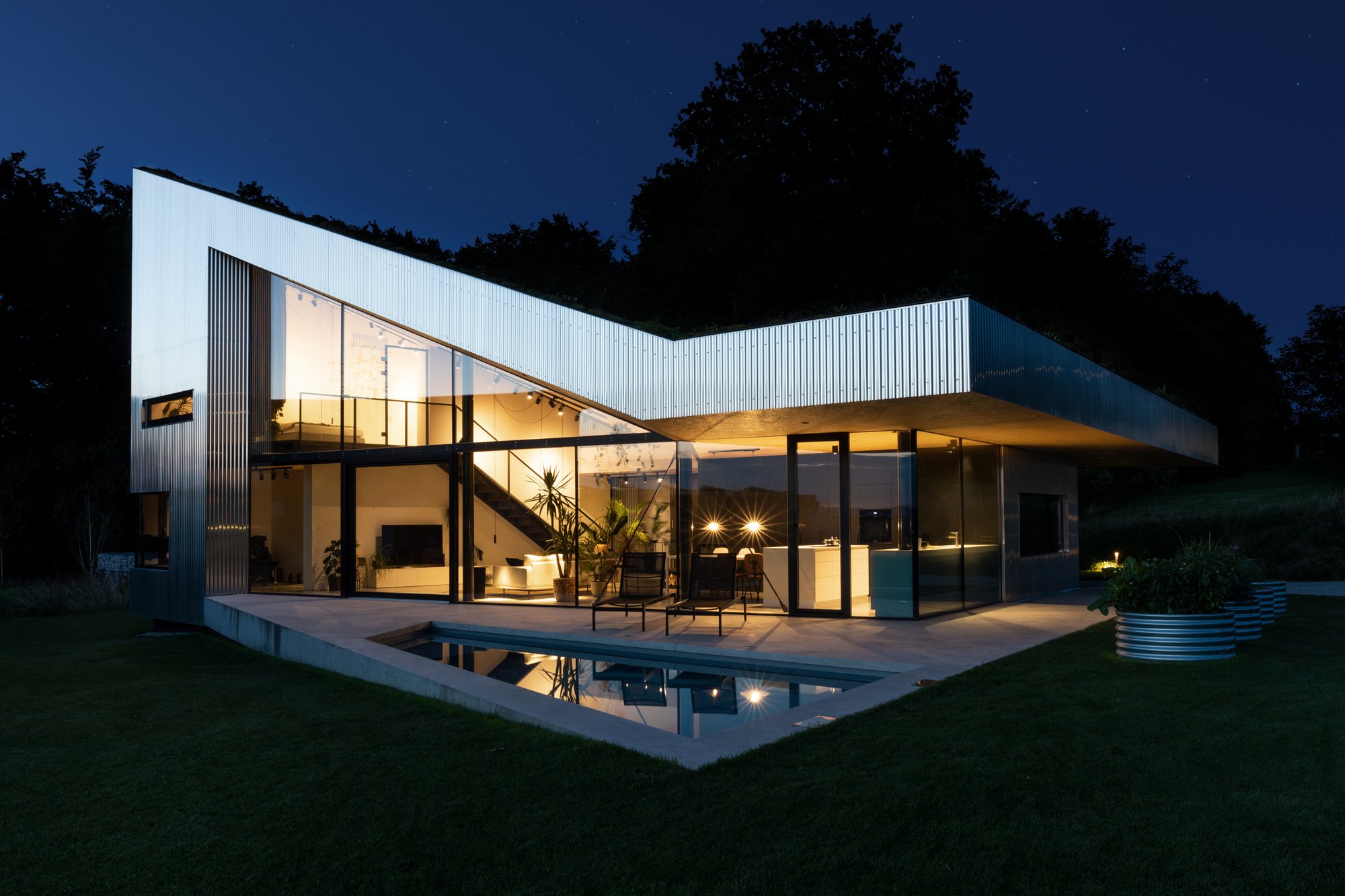 Caramel Architekten Folds a Green Roof Down to Earth in an Austrian Hilltop House