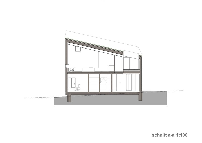 Section drawing showing the two-level interior volume beneath the sloped roof structure