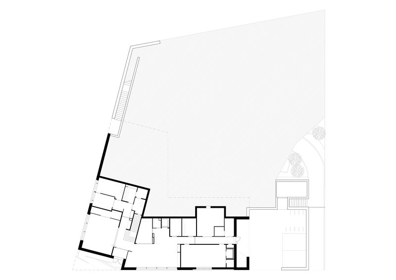 Ground floor plan drawing showing angled interior rooms and a large open courtyard area