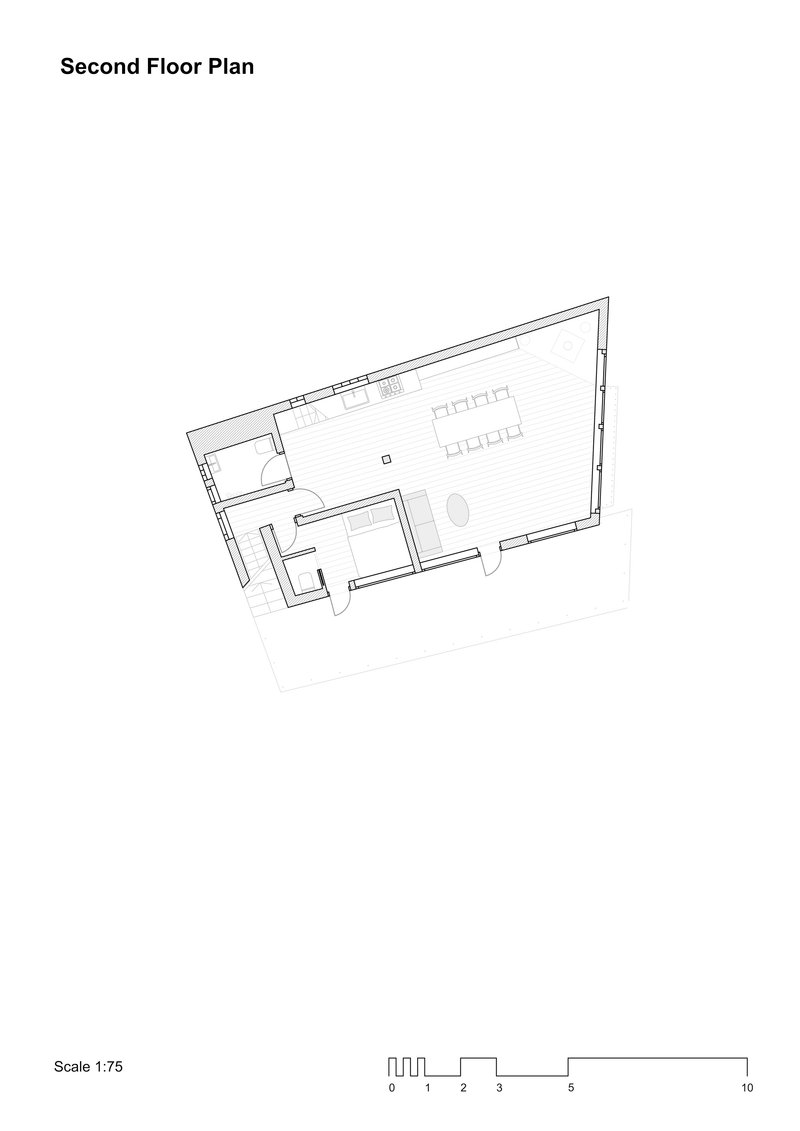 Second floor plan drawing showing an open space with kitchen and dining areas