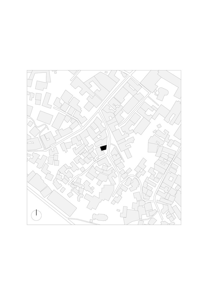 Site plan drawing showing the building footprint highlighted in black within the surrounding urban fabric