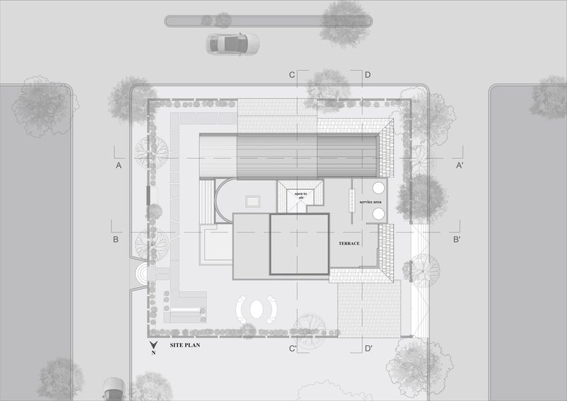 Site plan drawing showing the residential building footprint surrounded by trees and adjacent roads