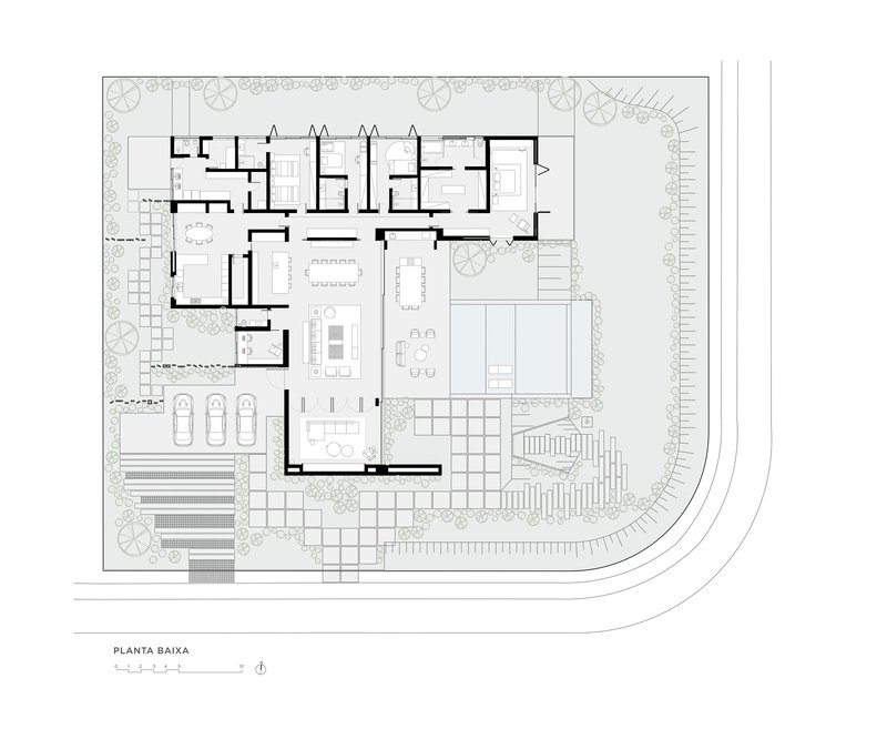 Ground floor plan drawing showing an L-shaped house with interior courtyard, pool, and surrounding landscaped areas