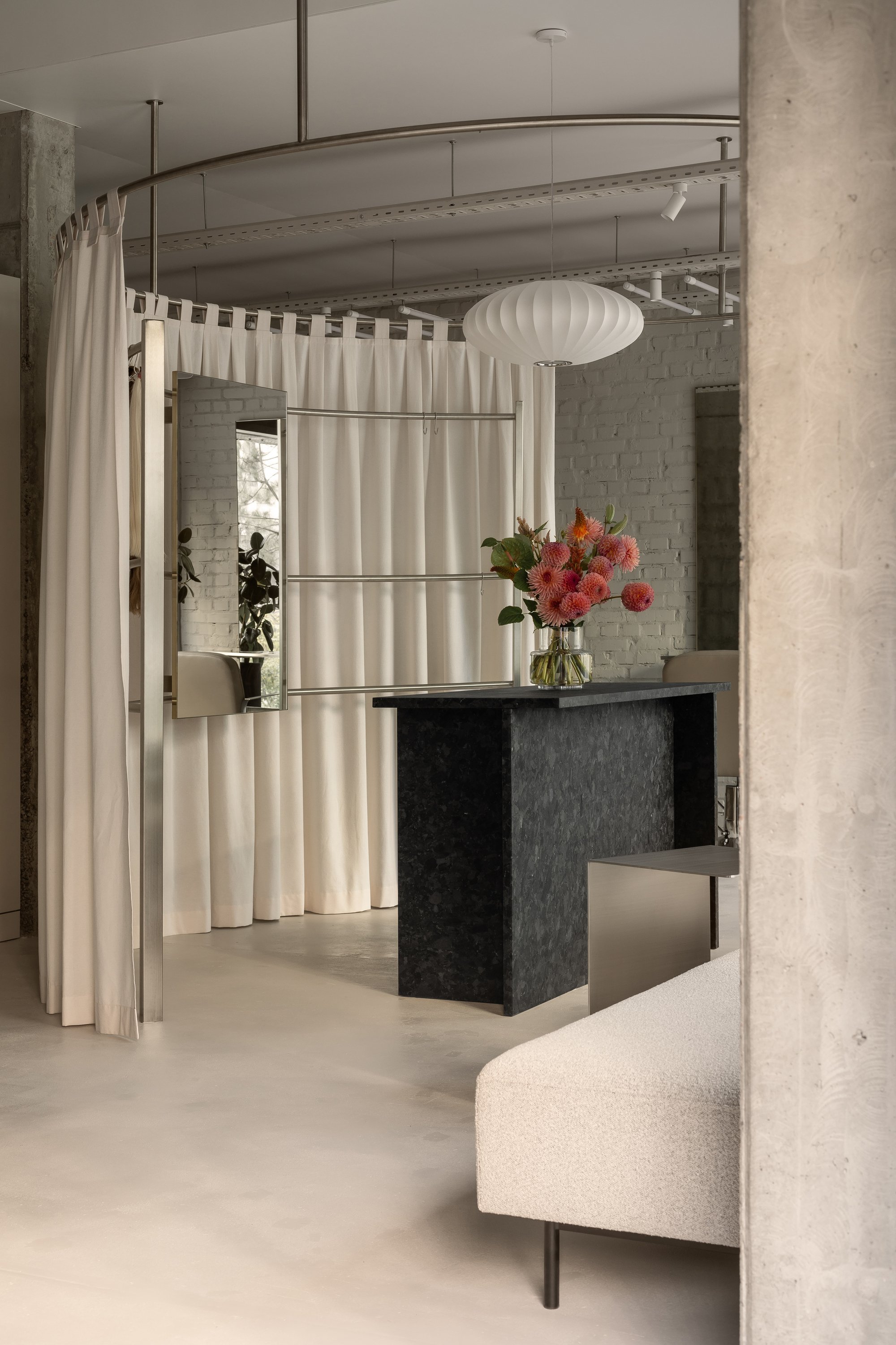 MAVA Design Turns a Column-Riddled Shell into a Serene Hair Extension Salon in Kyiv