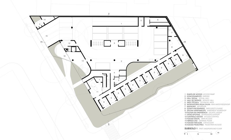 Floor plan drawing showing first underground level with parking, service areas, and angled building perimeter