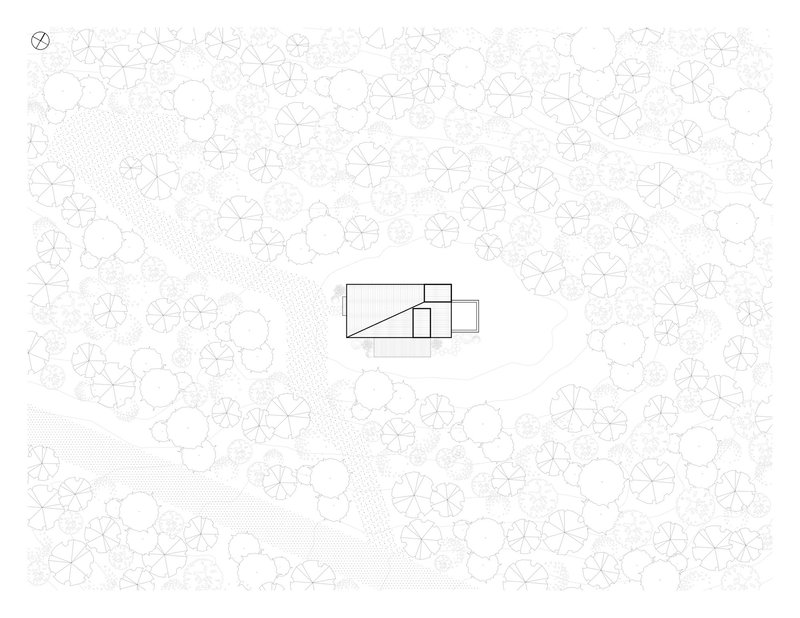 Site plan drawing with building footprint centered among stylized tree canopy circles