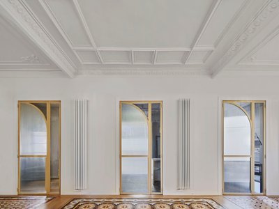 Cometa Architects Turns a Dark Barcelona Modernista Apartment into a Cinematic Sequence of Brass and Glass