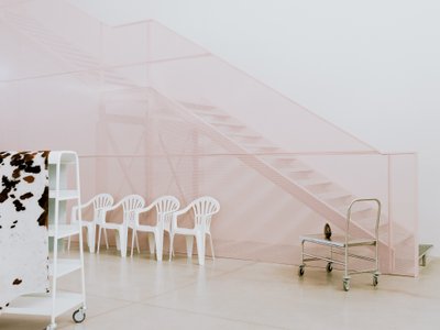 deltastudio Wraps an Italian Warehouse in Curtains and Pink Light for Bottega Bruzziches