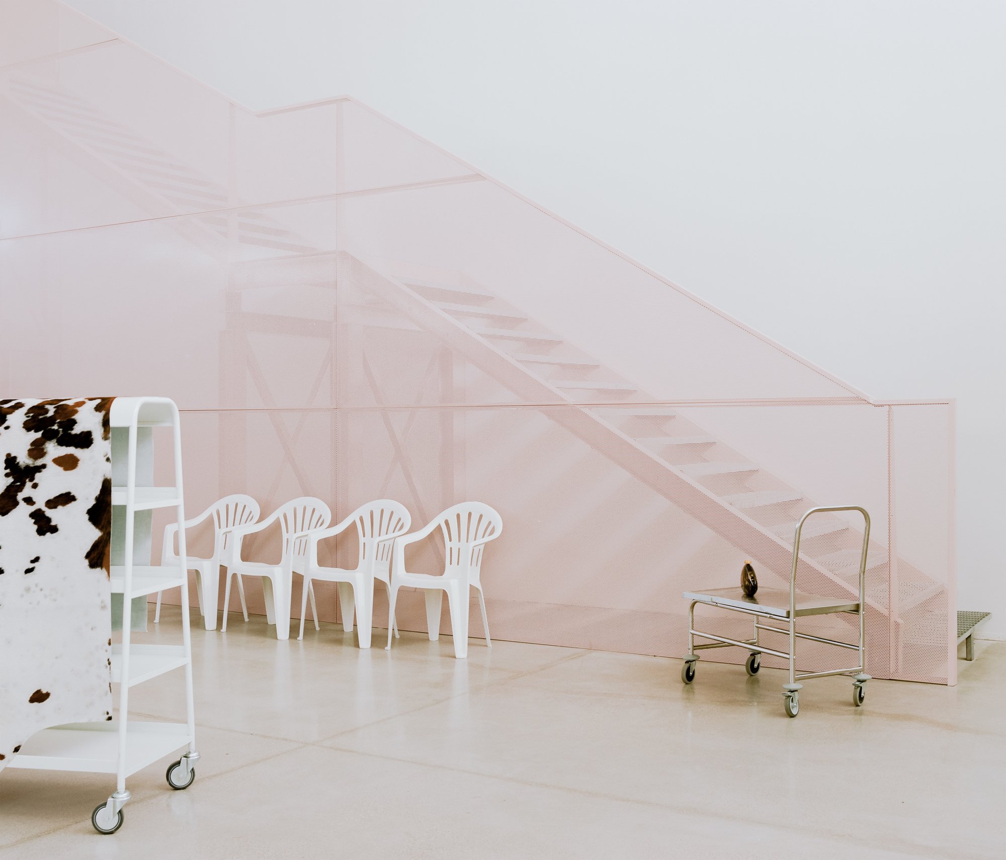 deltastudio Wraps an Italian Warehouse in Curtains and Pink Light for Bottega Bruzziches