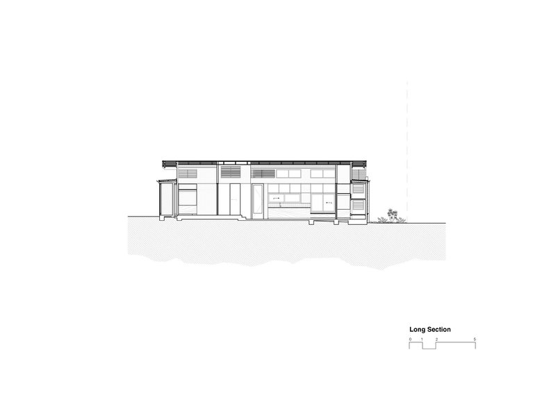 Long section drawing revealing interior volumes with sloped ceiling and ground plane below grade