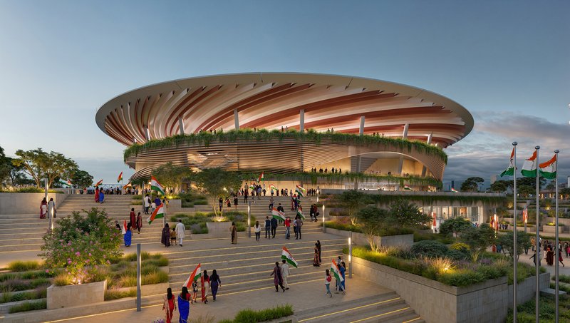 Oval stadium with radiating roof canopy and horizontal timber louvers over terraced plaza with planted beds