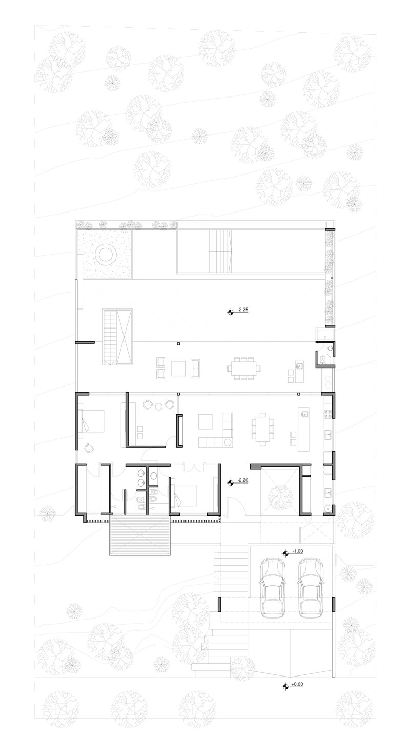 Floor plan drawing showing open living spaces with pool terrace and carport surrounded by trees