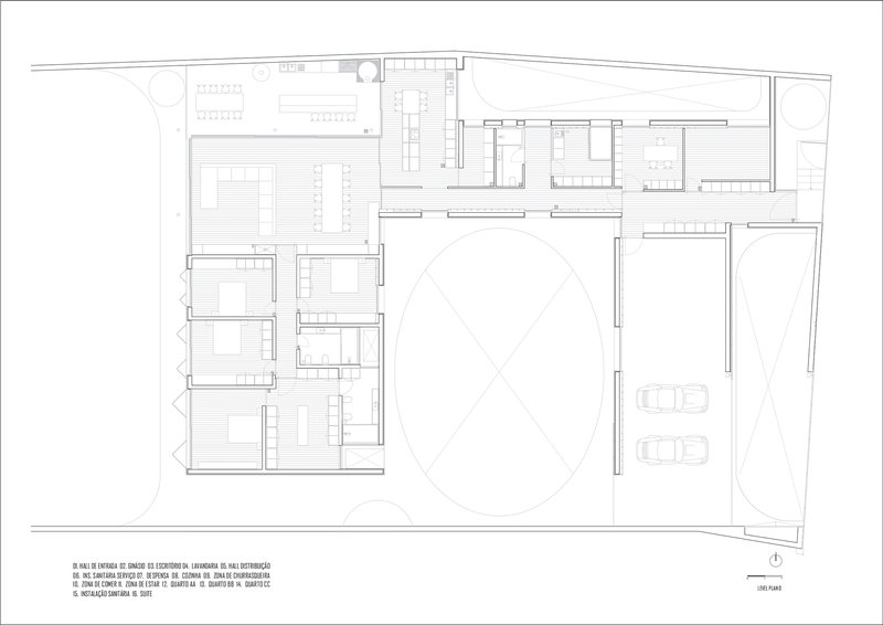 Floor plan drawing showing rooms arranged around a central oval courtyard with adjacent garage