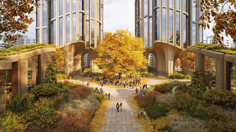 Elevated courtyard with paved walkways and autumn trees between paired arched canopies at tower bases