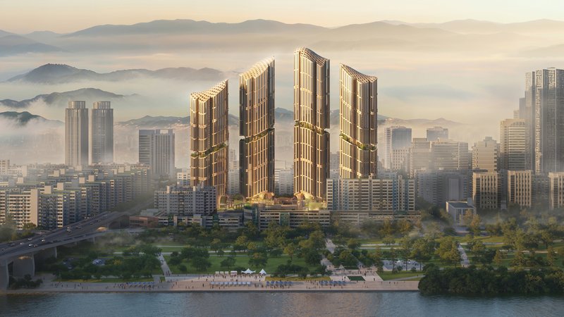 Five ribbed residential towers rising above a waterfront promenade at dawn with misty mountains beyond