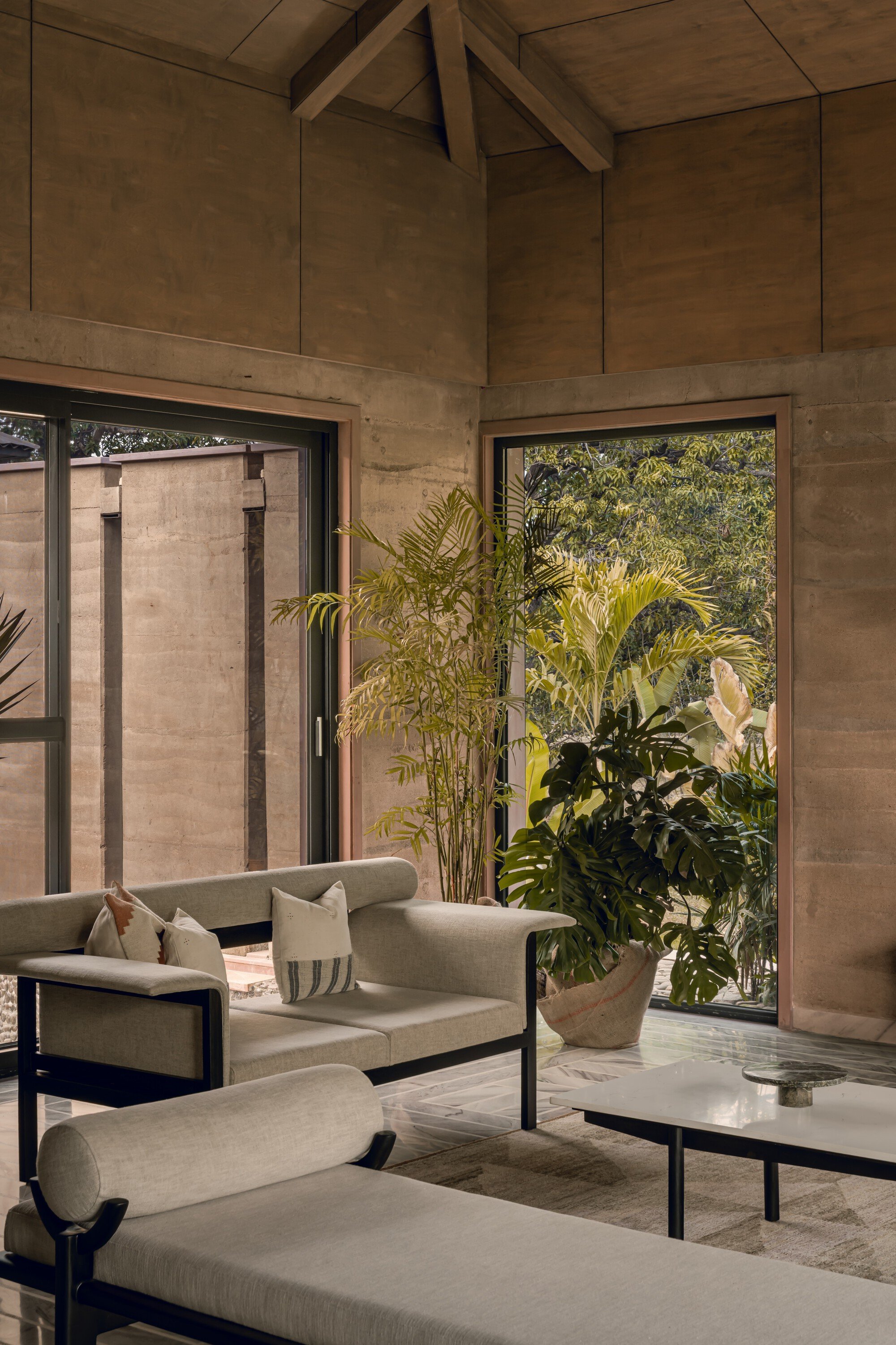 Neelesh Chopda Architecture Builds a Rammed Earth Retreat in a 12-Acre Mango Orchard