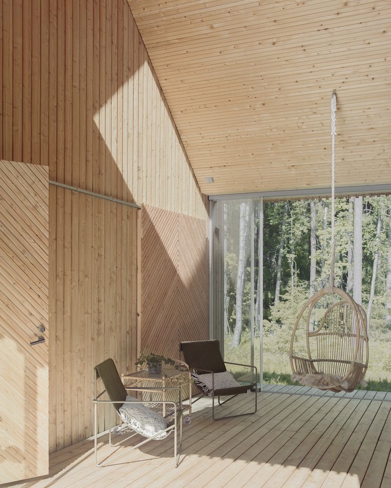 Double-height interior with angled timber walls, sunlight streaming across seating area and hanging wicker chair facing forest