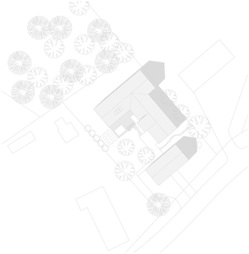 Site plan drawing showing building volumes surrounded by stylized tree canopies and pathways