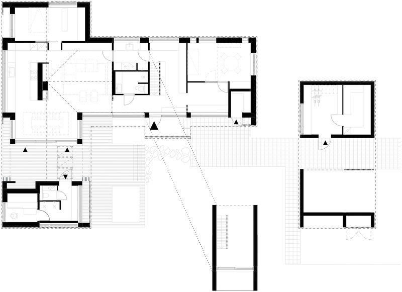 Floor plan drawing showing interconnected rooms around a central courtyard with covered deck areas