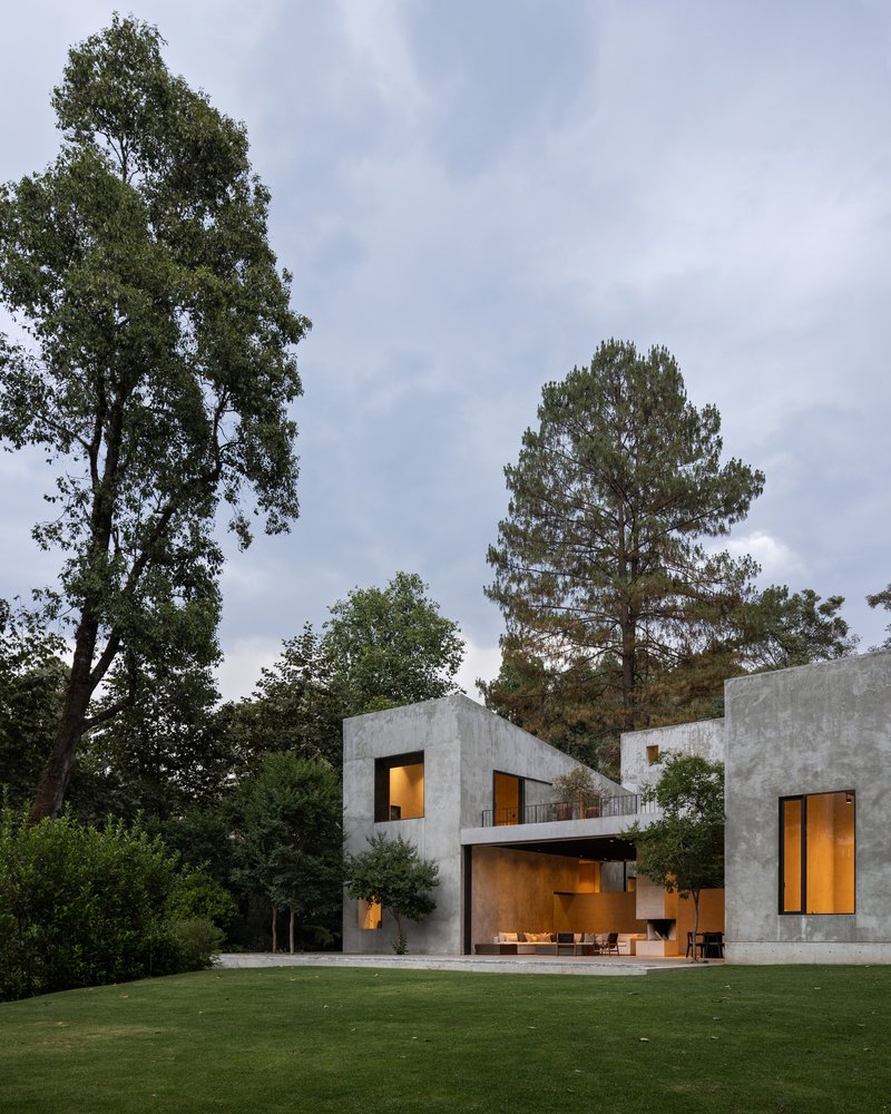 ESTUDIO Ignacio Urquiza Ana Paula de Alba Steps a Concrete House Down a Forested Slope in Valle de Bravo