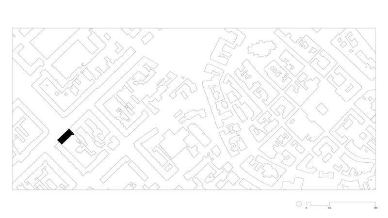 Site plan drawing showing single building footprint highlighted in black within surrounding urban fabric