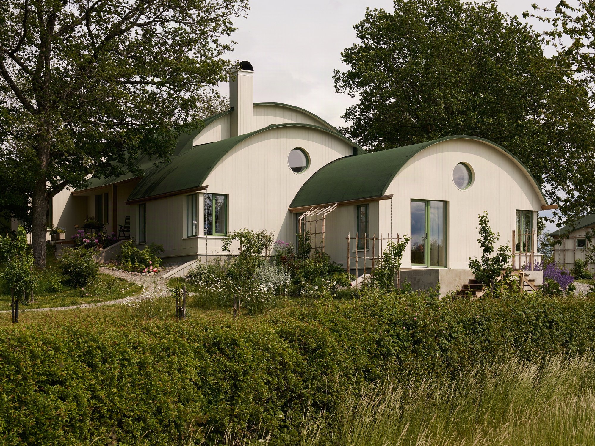 Strombro Building Workshop Sculpts a Trio of Barrel Vaults for an Artist's House on a Swedish Hillside