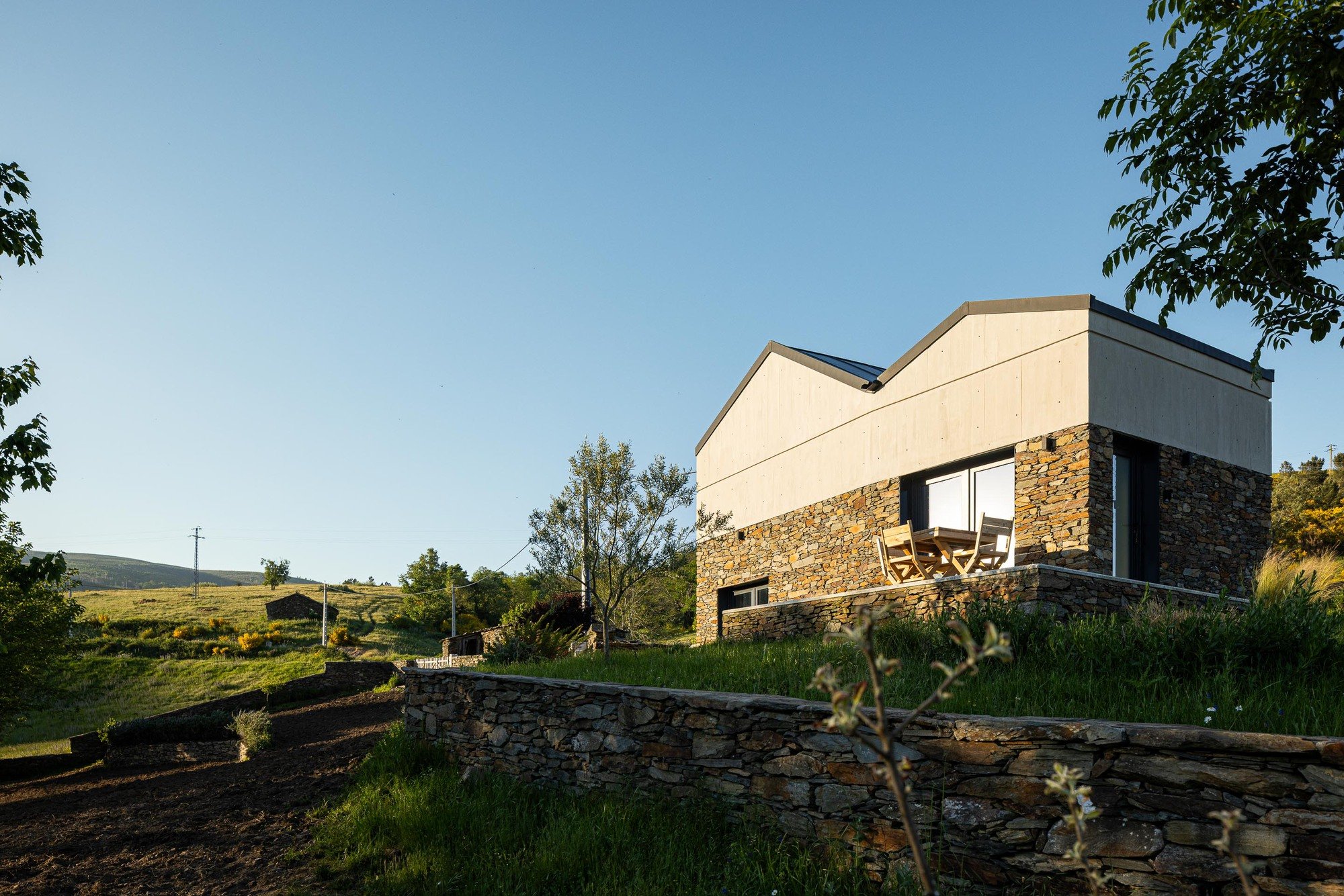 Atelier DRK Grafts a Cantilevered Timber Volume onto Stone Ruins in Serra da Estrela