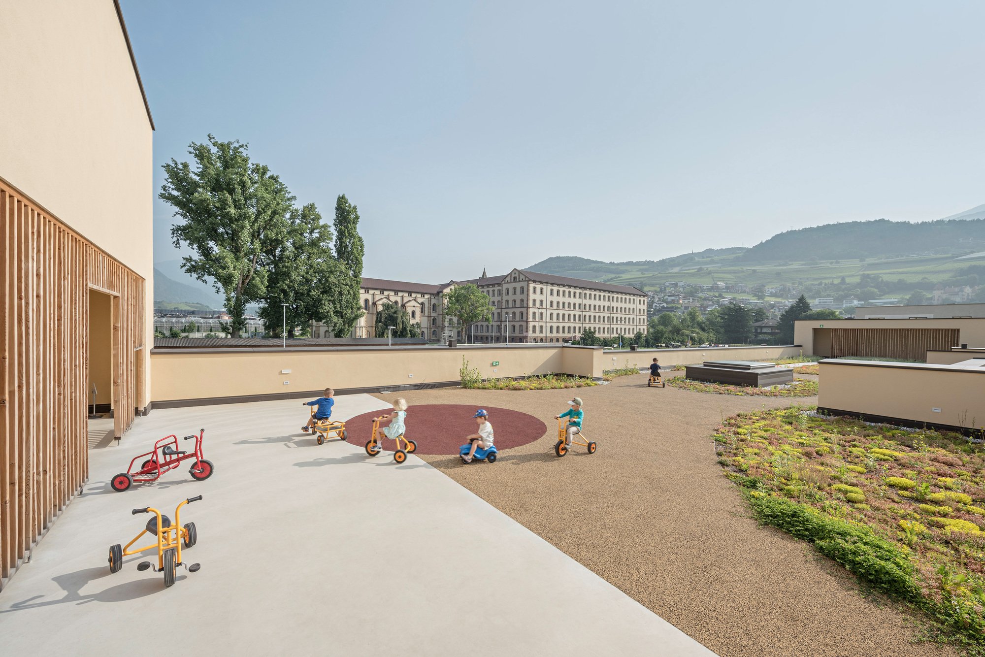 feld72 Designs a Kindergarten in Brixen Where Rooms Flow Like a Village Street