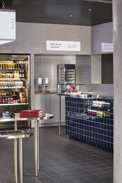 This architectural photo showcases a modern self-serve station in a retail or cafe setting. The desi