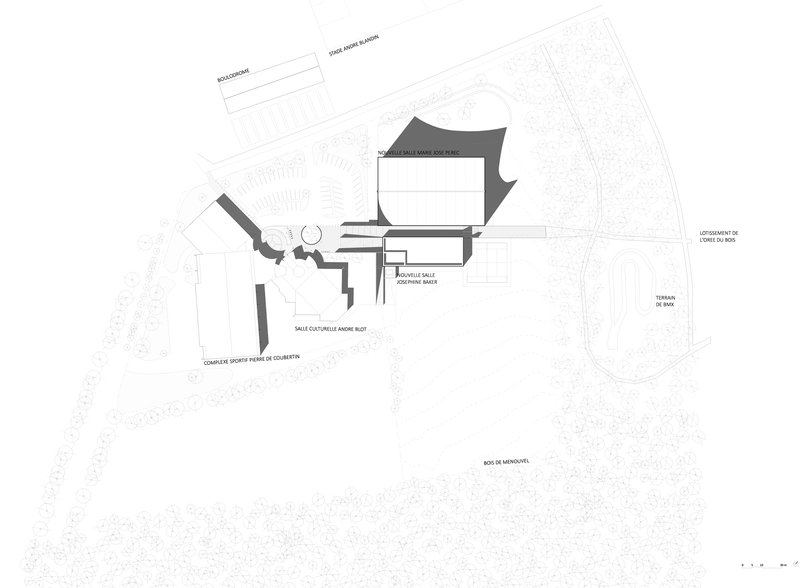 Site plan drawing showing the building footprint with surrounding sports facilities and wooded areas