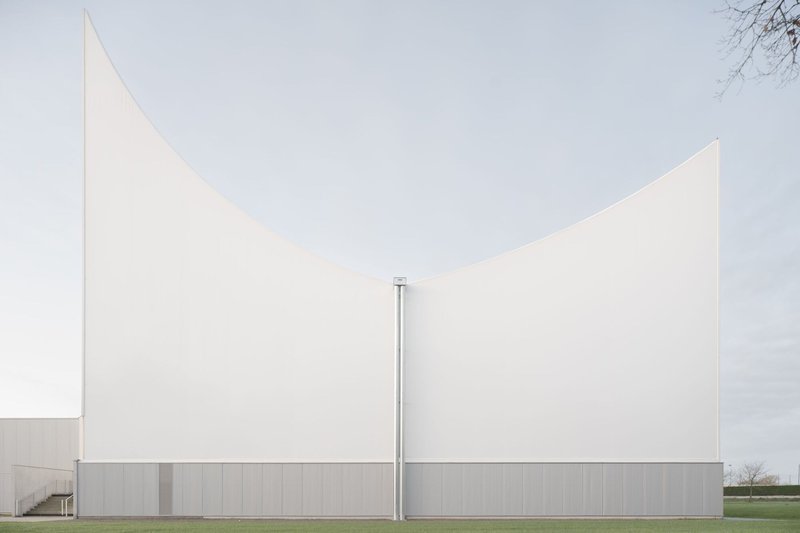 Frontal view of the twin folded panels meeting at a central seam with grey paneling below