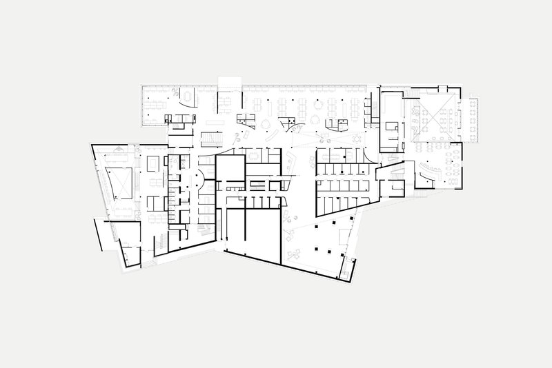 Floor plan drawing revealing a large central hall flanked by smaller rooms and angled wings