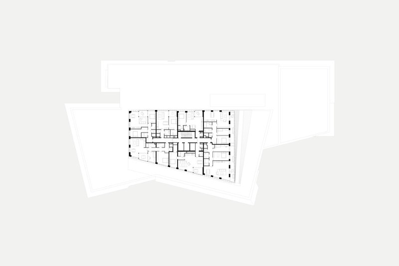 Floor plan drawing depicting residential units organized along a central corridor with exterior terraces