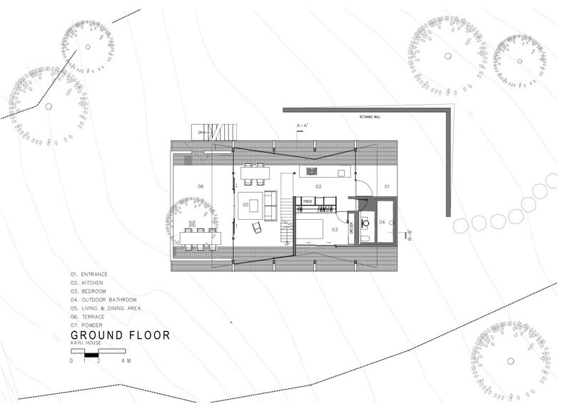 Ground floor plan drawing showing living spaces, kitchen, and covered deck surrounding the A-frame volume