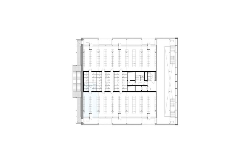 Second-floor plan: library reading room occupying most of the floor with rows of bookshelves and study carrels, central core with stairs and service rooms, rotunda opening visible on the left