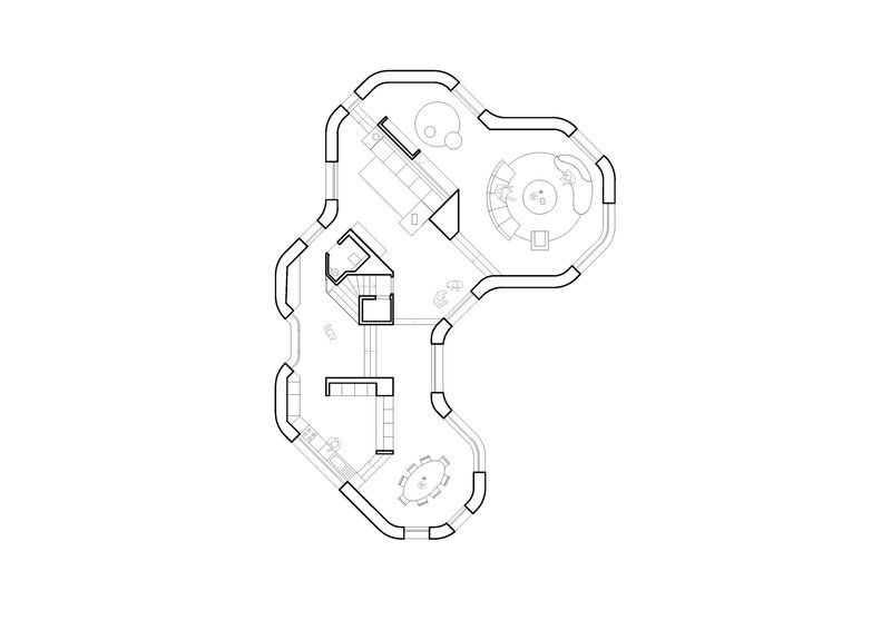Floor plan drawing showing three lobed volumes connected by a central corridor with furniture layout