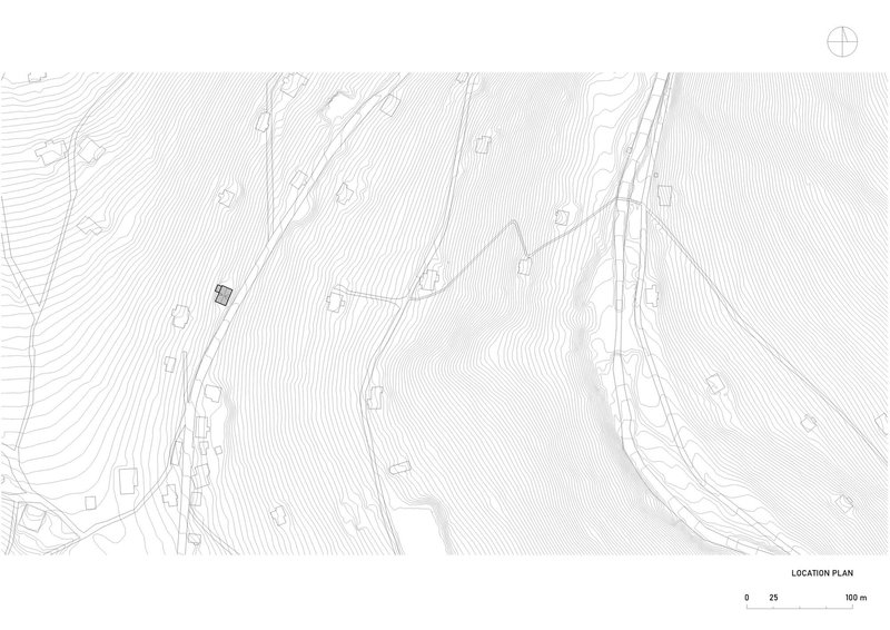 Site plan drawing with topographic contours showing the building placement on sloping terrain