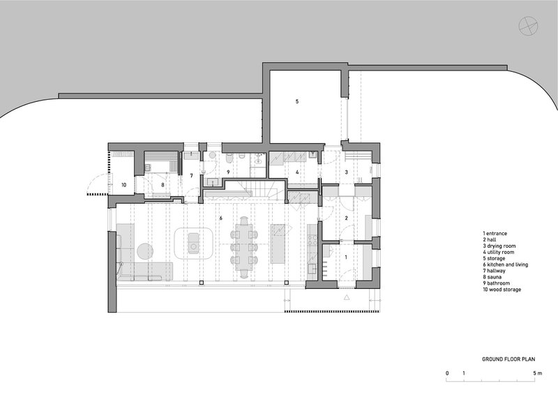 Ground floor plan drawing showing open-plan living and dining spaces with curved site boundary