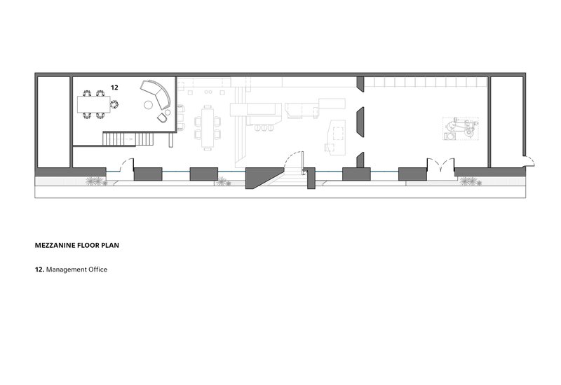 Floor plan drawing showing a long rectangular layout with stair and conference area at left end