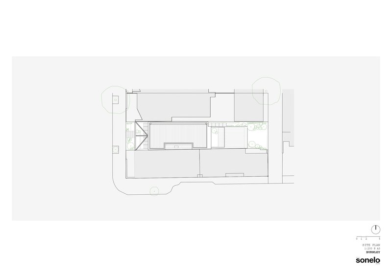 Site plan drawing showing building footprint with courtyard and surrounding landscape elements