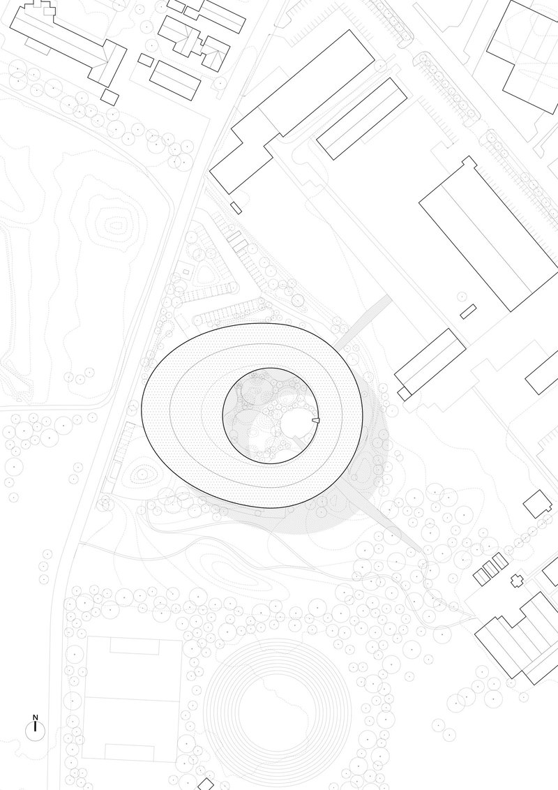 Site plan drawing showing the circular building footprint surrounded by landscaping and adjacent structures