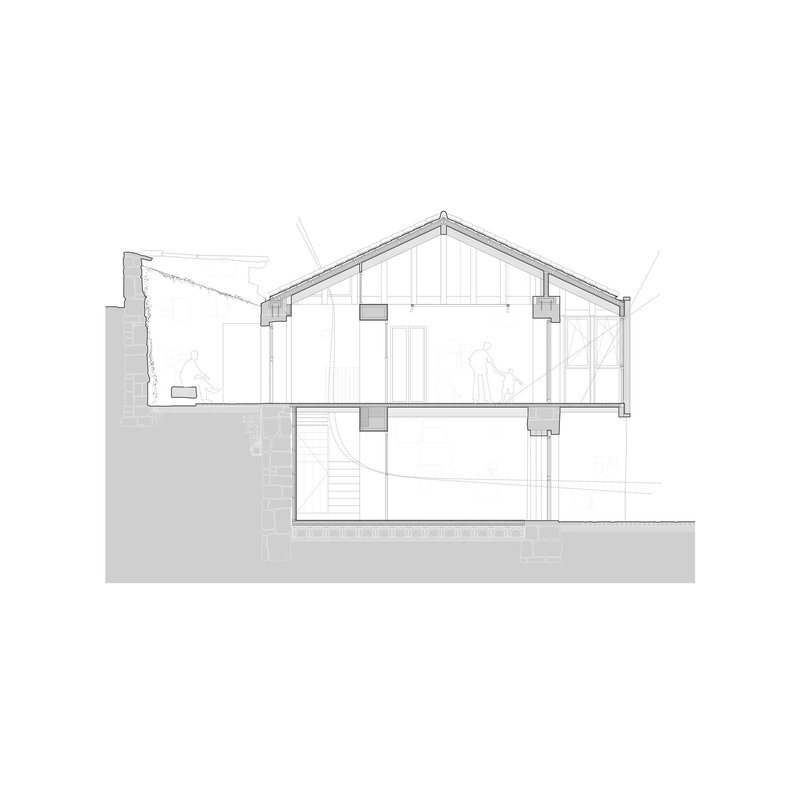 Section drawing showing a two-story residence with pitched roof and basement level