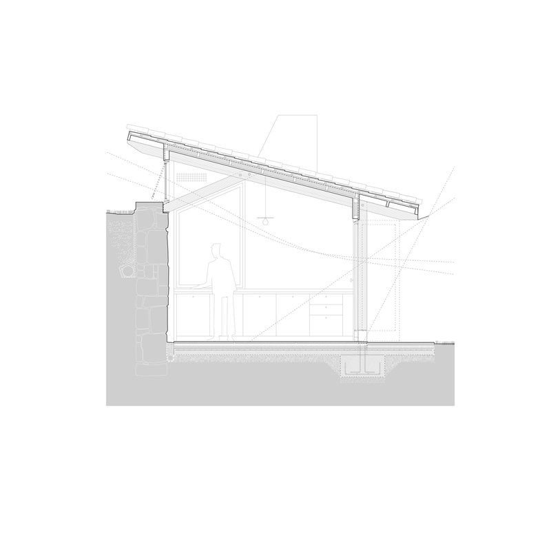 Section drawing showing sloped roof structure and a figure standing on the upper level