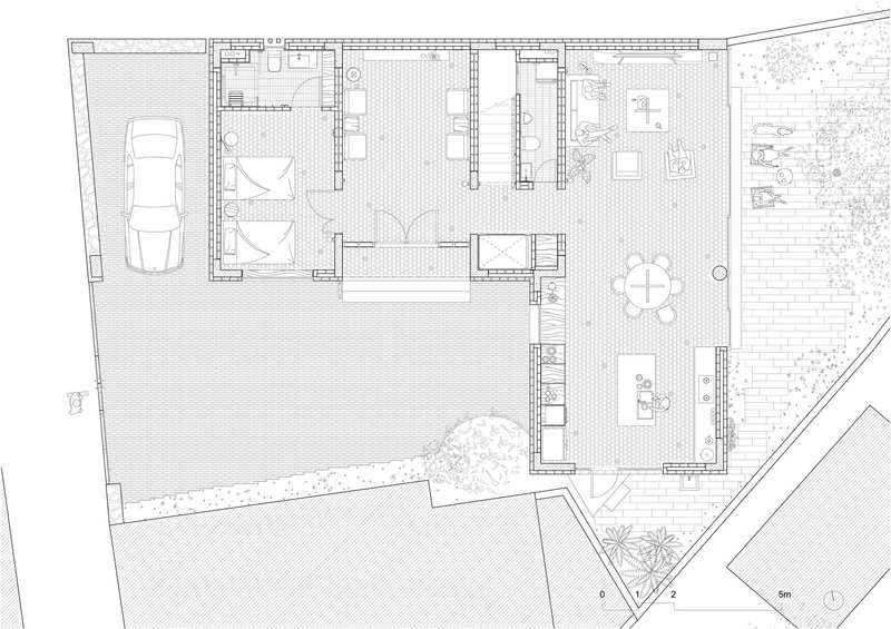 Ground floor plan drawing showing garage, living areas, courtyard, and planted garden zones