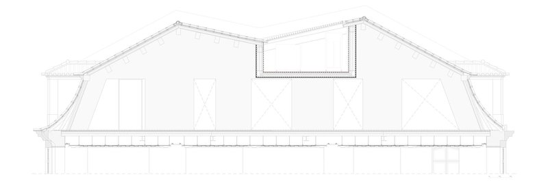 Section drawing showing a curved roof structure with a central skylight and supporting columns below