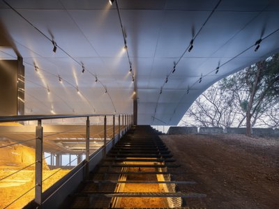 This architectural photograph showcases a modern museum interior with a unique design. The image fea