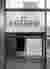 This image showcases a modern coffee kiosk with a minimalist design. The kiosk features a large "cof