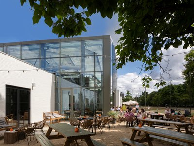 Buro Moon Converts a Dutch Museum into a Brewery, Café, and Food Hall Linked by a Greenhouse